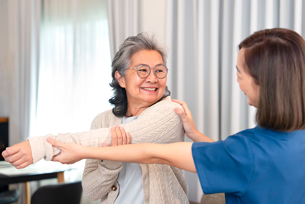 Positive emotion senior woman doing physiotherapy